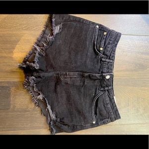 These jean shorts are a 42 in size and black.